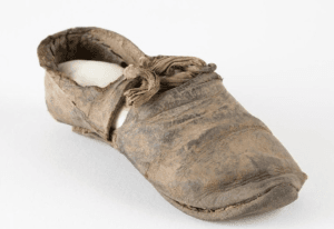 Worn leather child's shoe