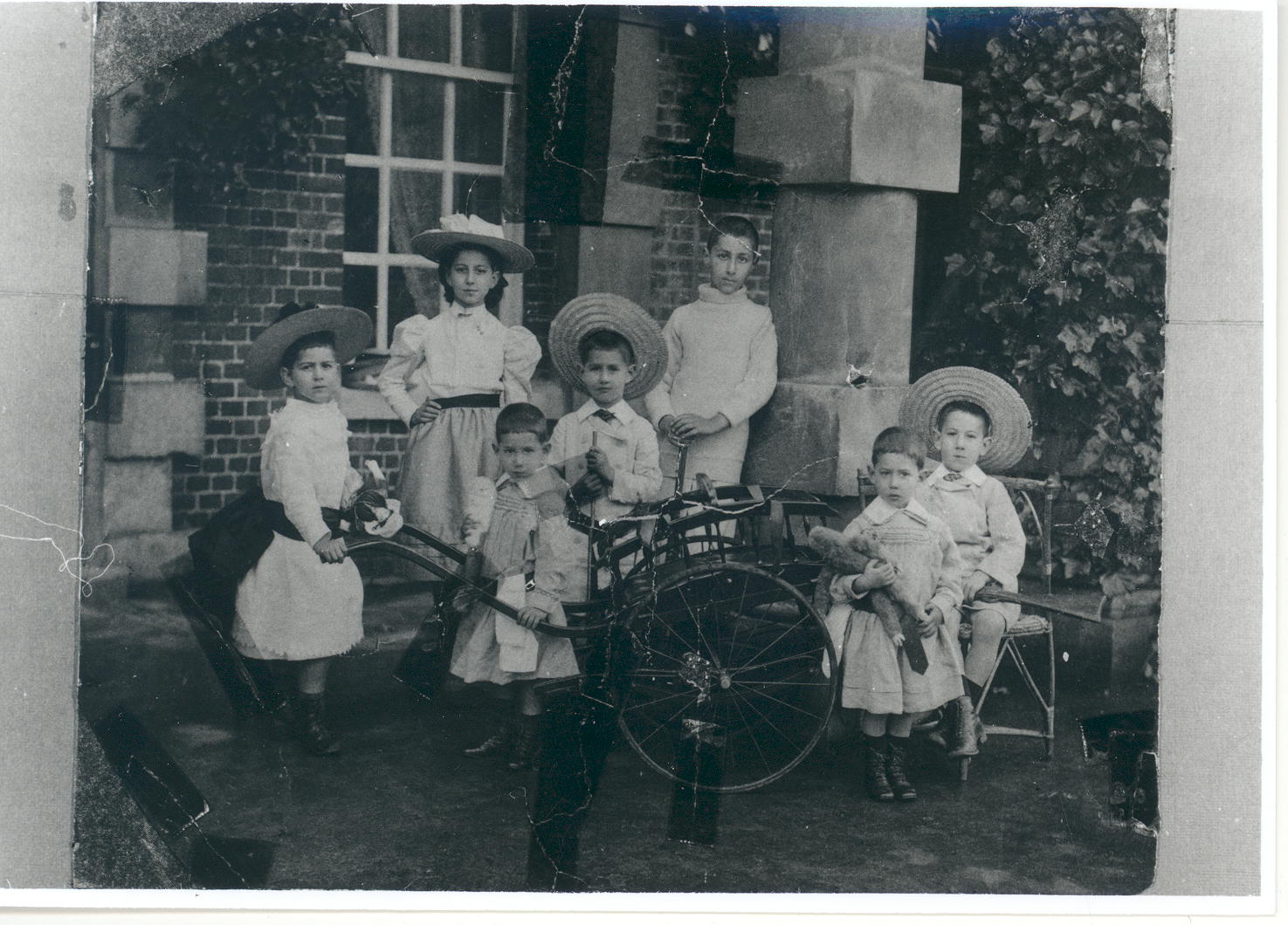 The seven children of Joseph and Louise Sassoon photographed outside Ashley Park c. 1897. They are (left-right) Mozelle, Missy, Freddy, Arthur, Totts, Teddy and David.