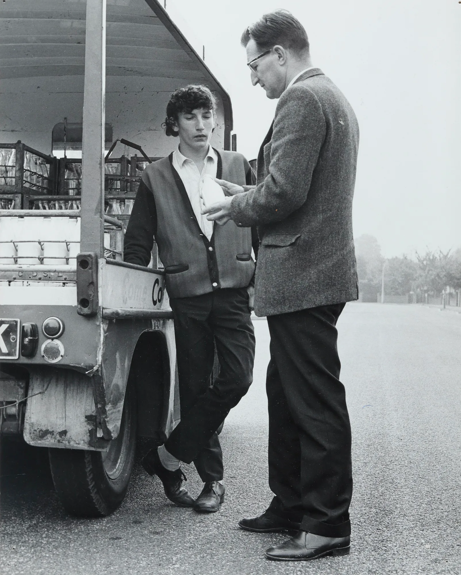 Arthur Bell checking milk on a float (c.1970s).