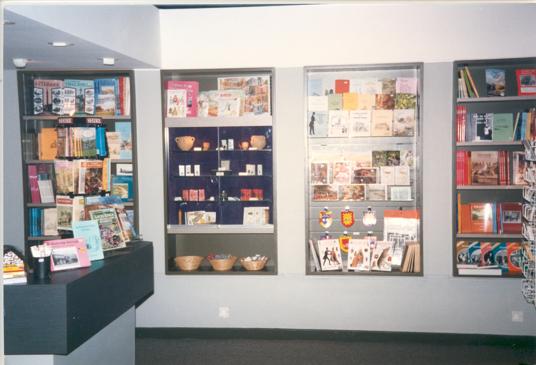 The refurbished Elmbridge Museum shop with four display recesses and the shop counter to the left, at the re-opening on the 10th December 1996.