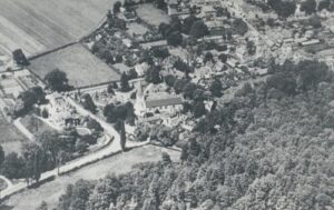 Aerial view of Church Cobham with St. Andrew's Church in the centre, 1923