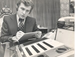 Mr. Howard Lander operating a compact computer system, at ''Milegate House'', Hersham, 23rd January 1978.