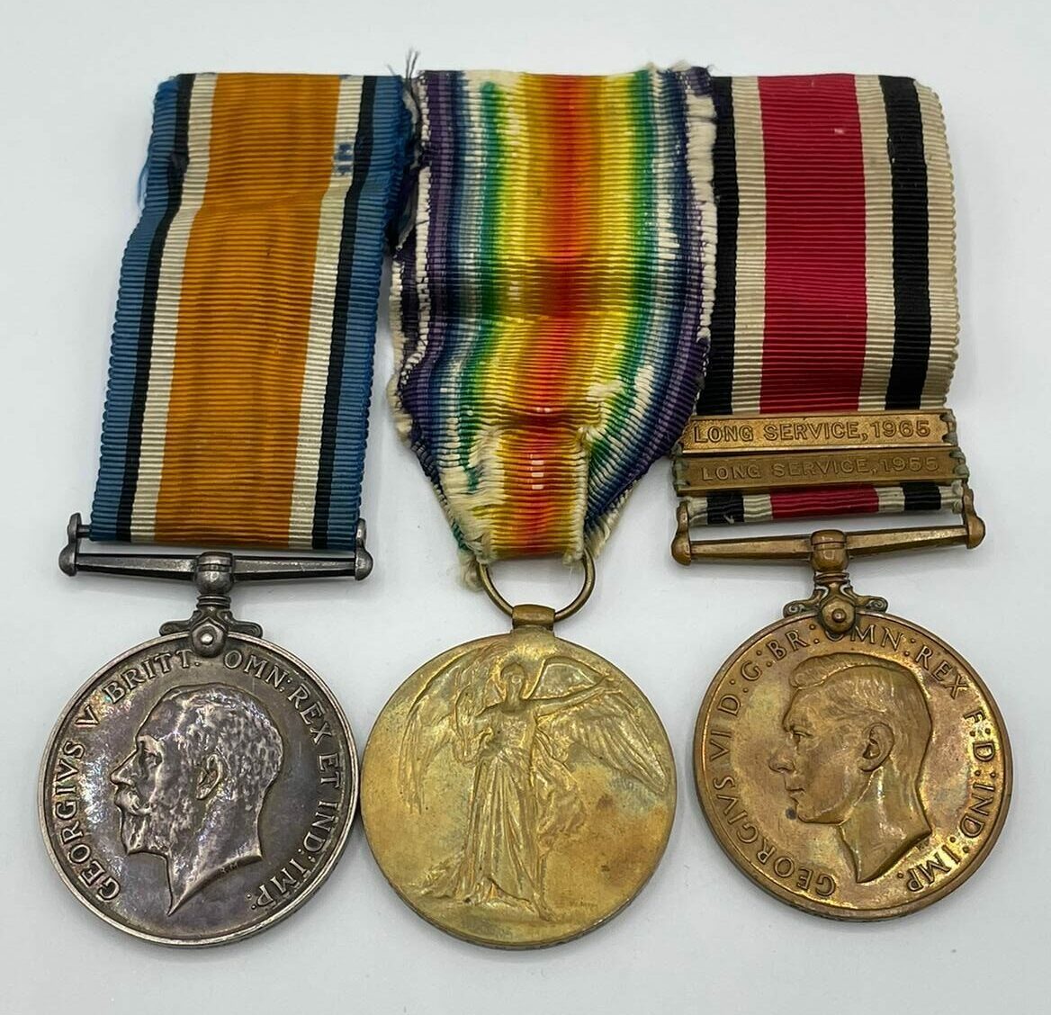 British Red Cross Medals awarded to Miss Molly Jack in 1941 for First Aid, Home Nursing and three years service.