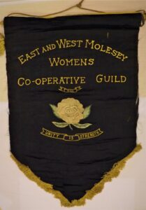 Black satin banner for the East and West Molesey Women's Co-operative Guild in 1935.