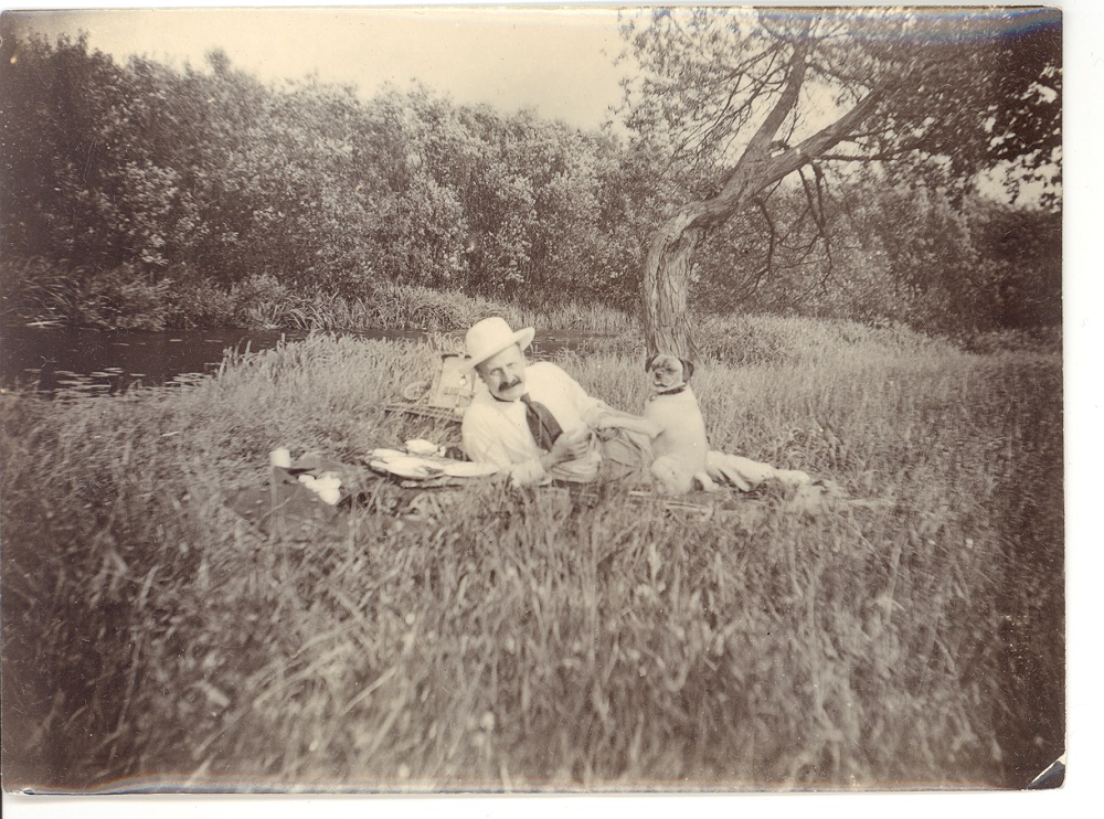 Edgar Bruce and Boodles the dog on a picnic