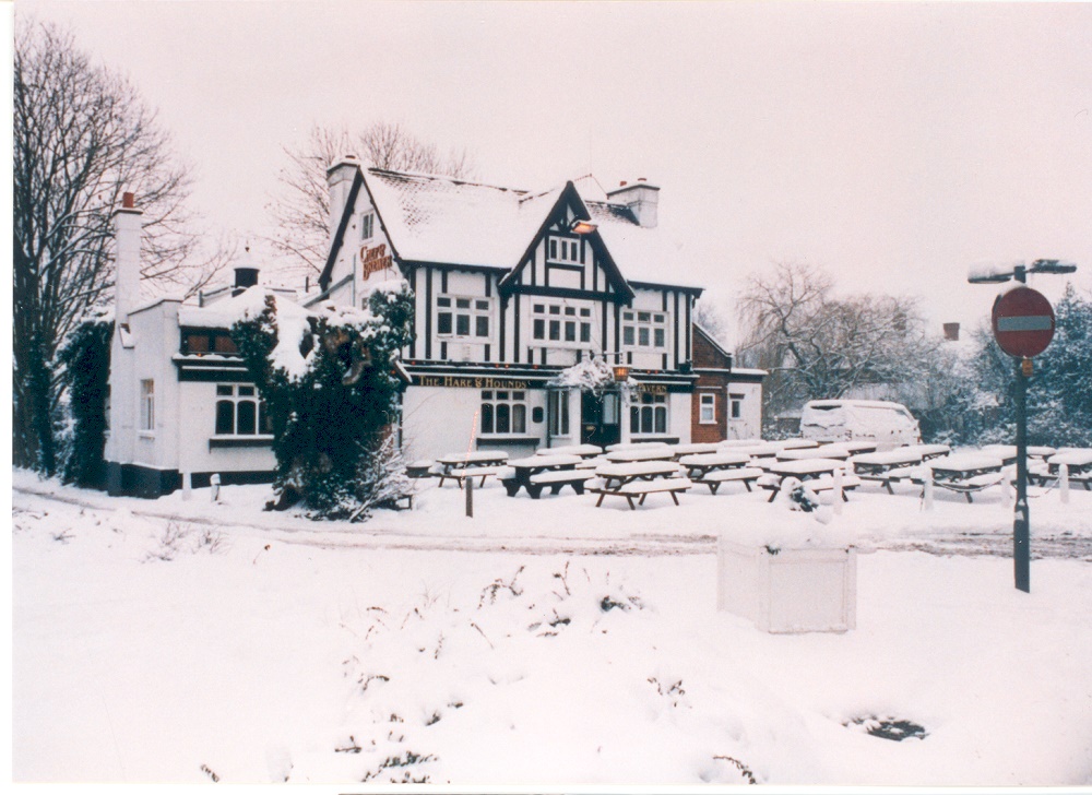 Colour photograph of The Hare and Hounds Public House, Claygate, in the snow, 1991.