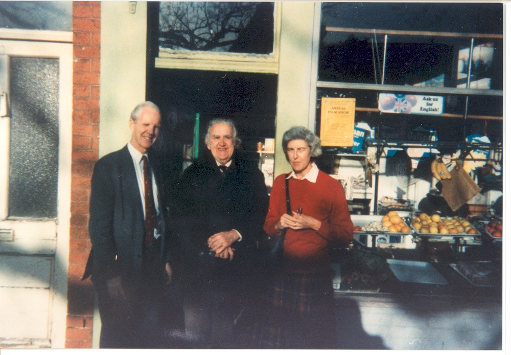 Colour photograph of Mr C. Hibbert Senior (Centre) with Mr & Mrs Hyatt (Mr Hyatt former Vicar at Claygate 1978-1989) outside Hibbert's Greengrocers, The Green, Claygate, Winter 1995.