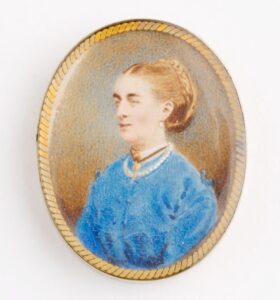 Miniature portrait of Madeline Gill in a gold coloured, oval frame. Like the locket, this may have been made as another memento in remembrance of her after her death.