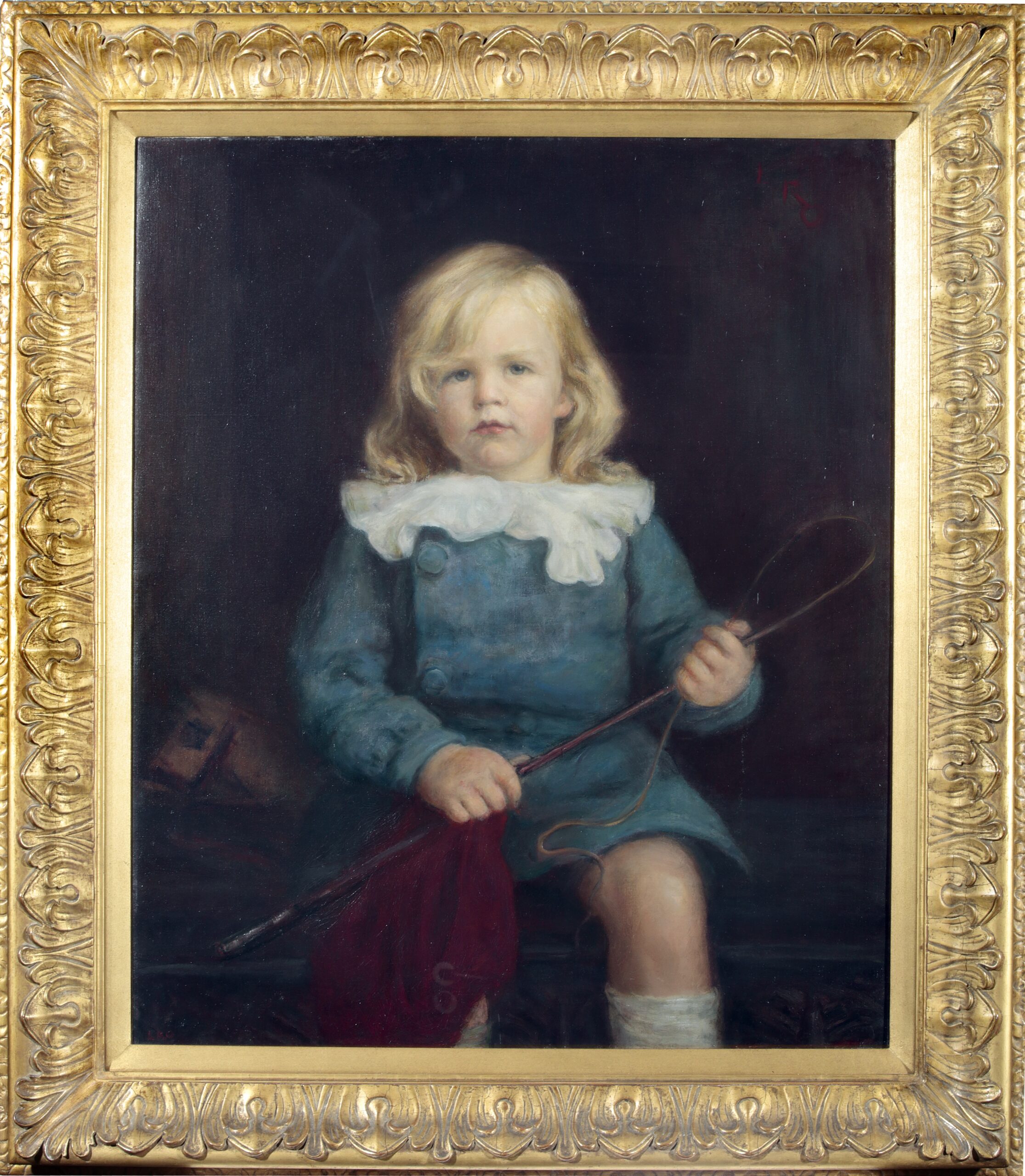 A framed oil painting portrait of Robert John Brooke Gill in 1913, aged 2, shown seated on a wooden chest. Behind him is the head of a toy horse, and he holds a riding whip and a piece of red cloth.
