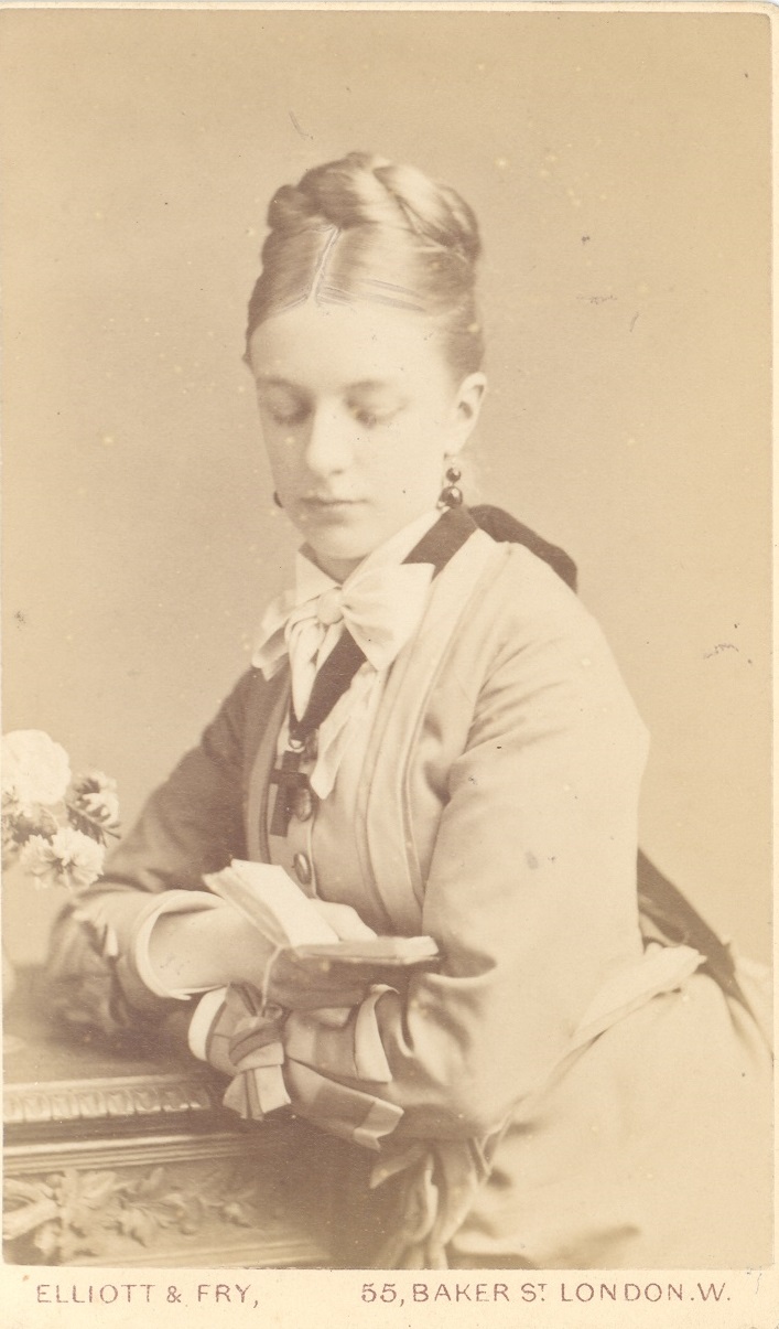 Eleanor Maud Gill, youngest daughter of Fanny and Robert Gill, photographed c.1880s reading a book.