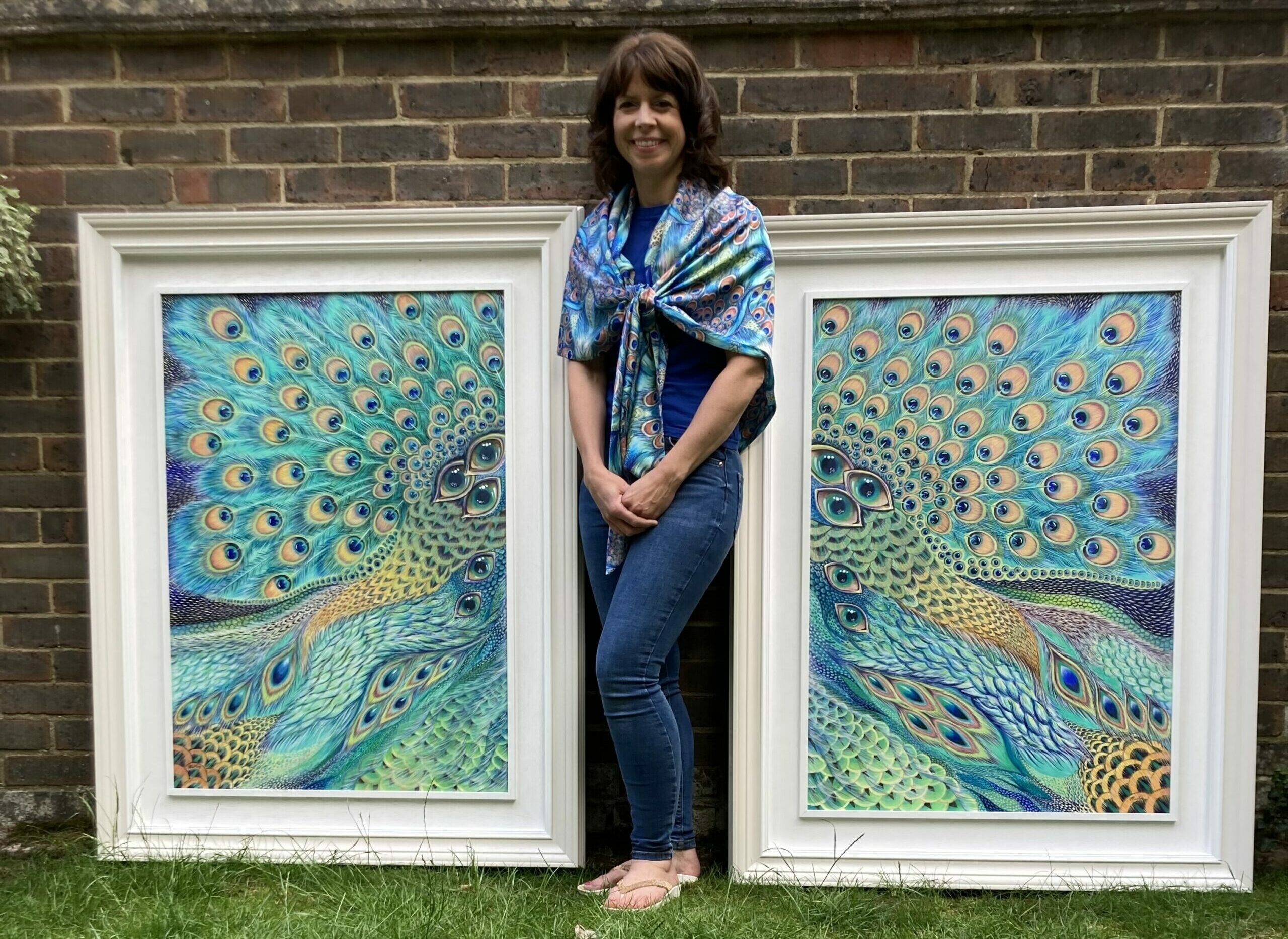Me standing beside my 'Peacock Patterns' paintings - now on display in a house at St George's Hill.