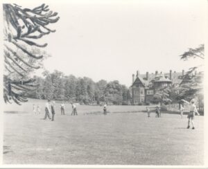 Pupils playing cricket in the grounds of Hatchford Park School, Cobham, c.1960s