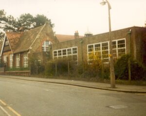 Photograph of St. James' School and buildings taken from Baker Street, spring / summer 1983.